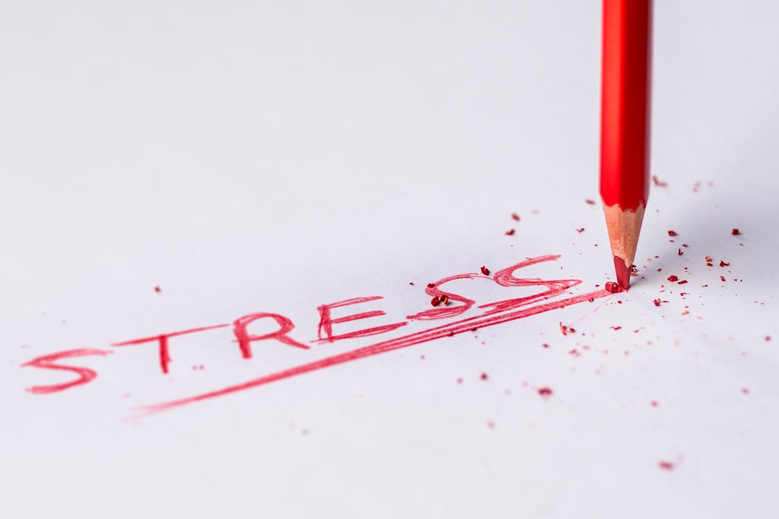 Free Stress Handwritten Text on White Printer Paper Stock Photo