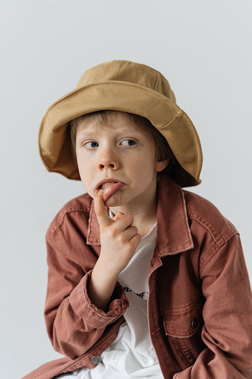 Boy Wearing a Brown Bucket Hat