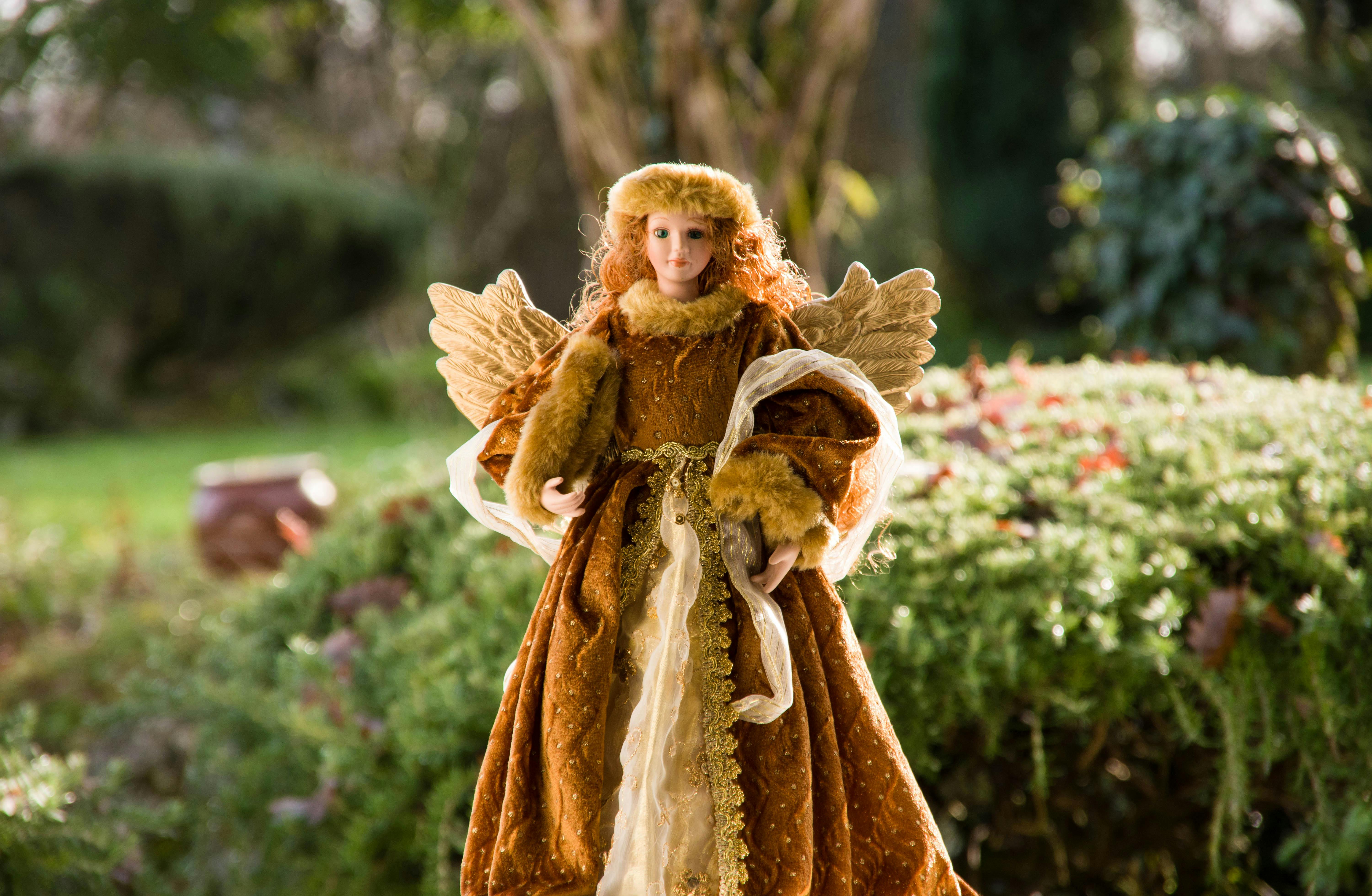 Figurine of an Angel Wearing a Fur Coat · Free Stock Photo