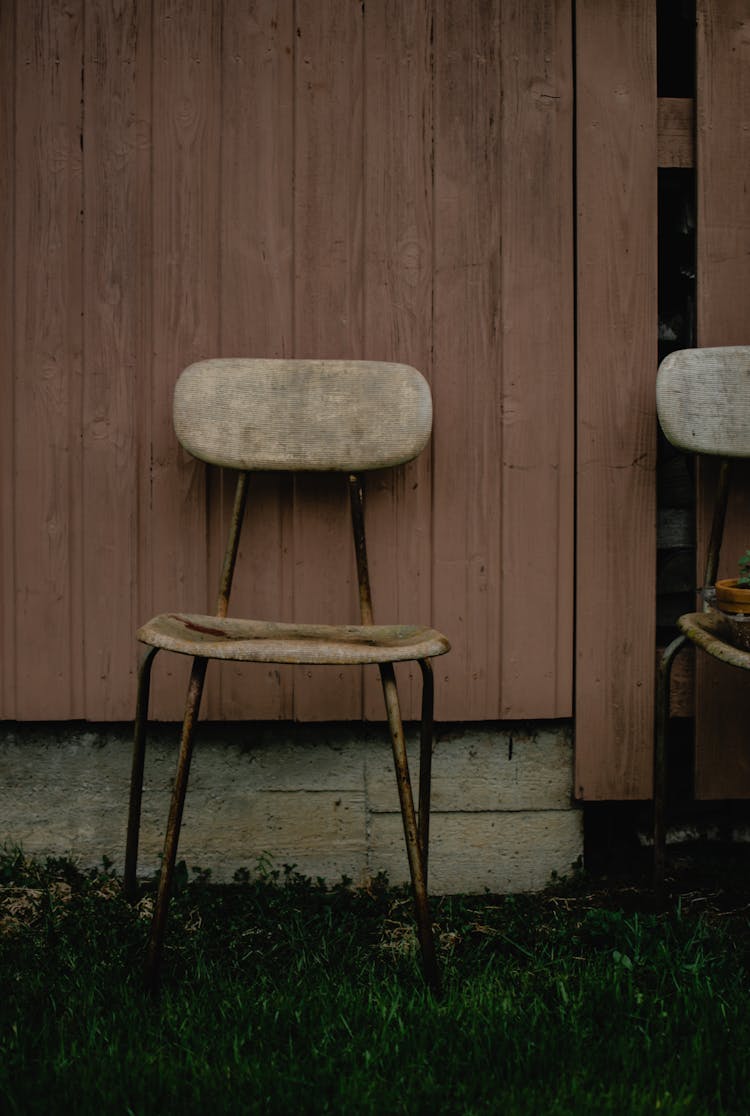 A Rustic Chair On The Grass