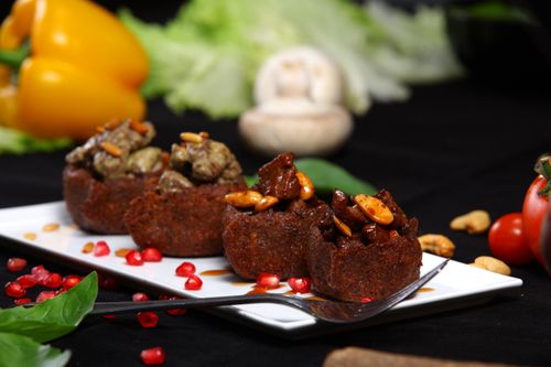 Free Close-up of delicious Middle Eastern dishes with nuts and spices on a white plate with vegetables. Stock Photo