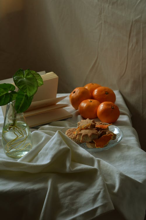 Cookies and Oranges on a Table 