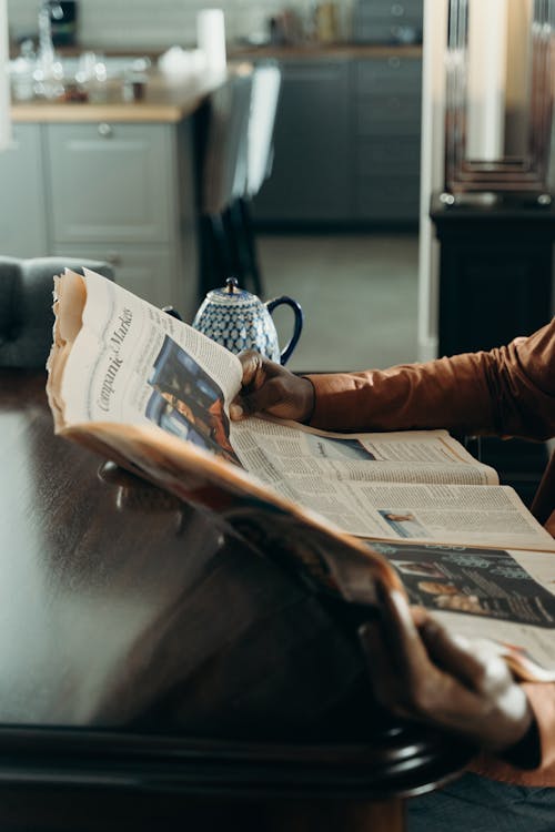 Free Person Reading the Newspaper Stock Photo