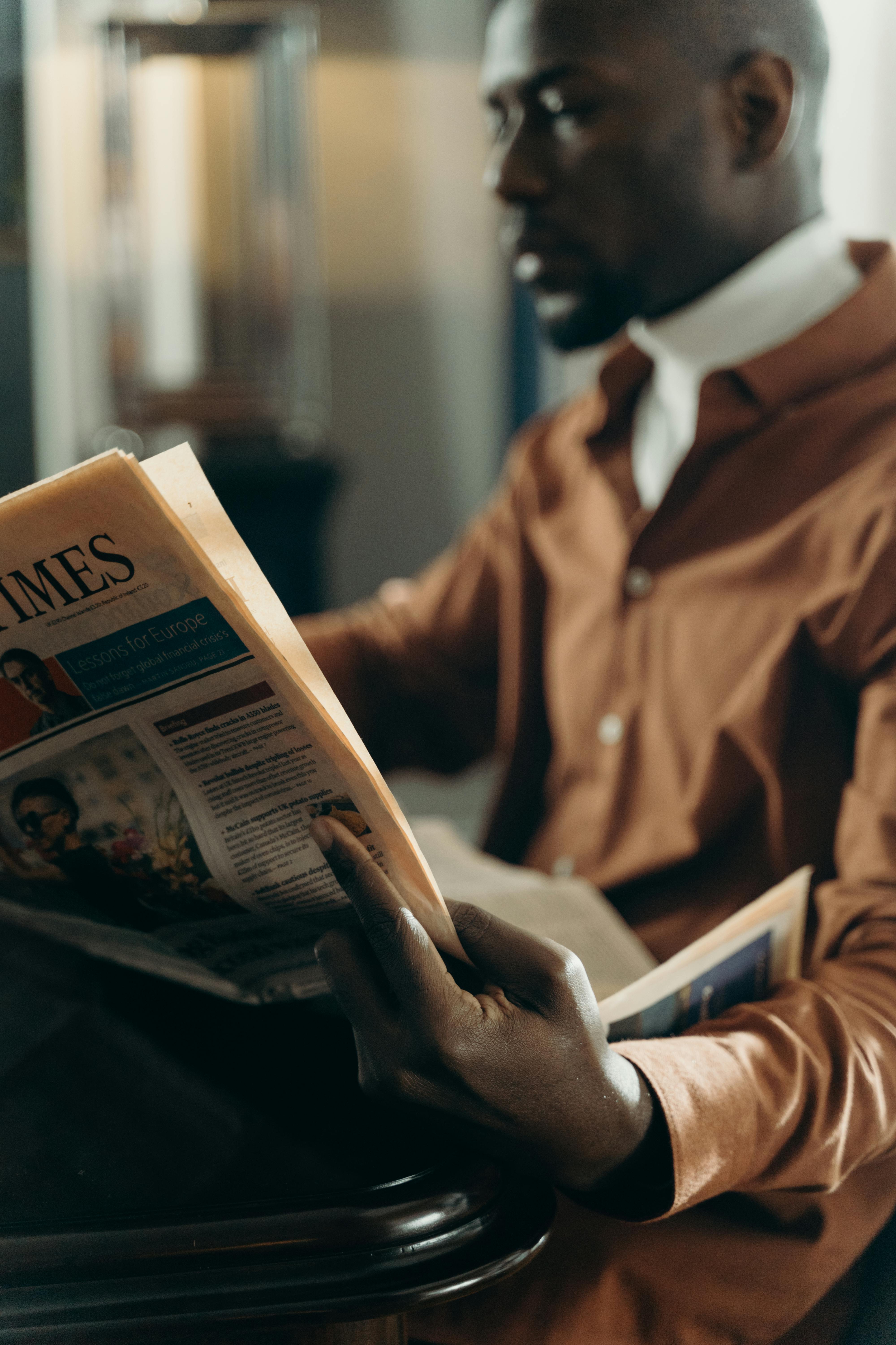 man reading a newspaper