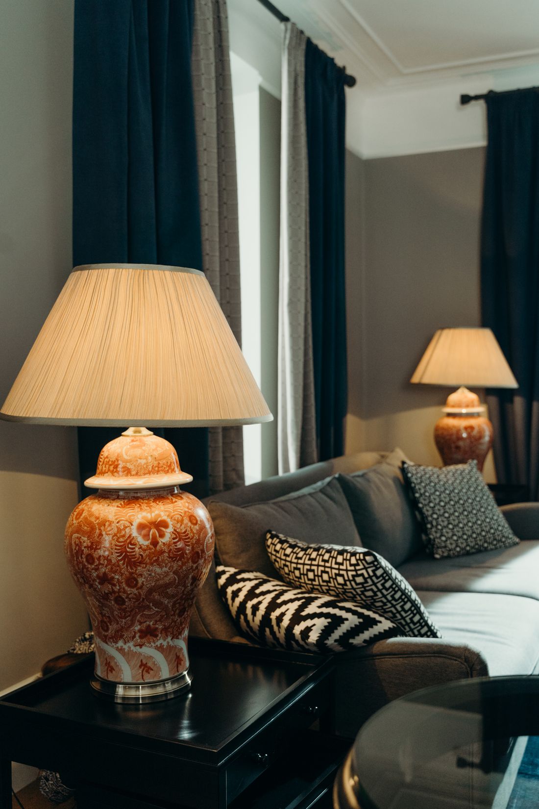 Living room with a pair of shaded lamps, photo by cottonbro studio on Pexels