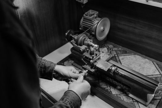 A Jeweler Using a Grinder
