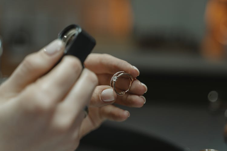 A Person Holding A Diamond Ring