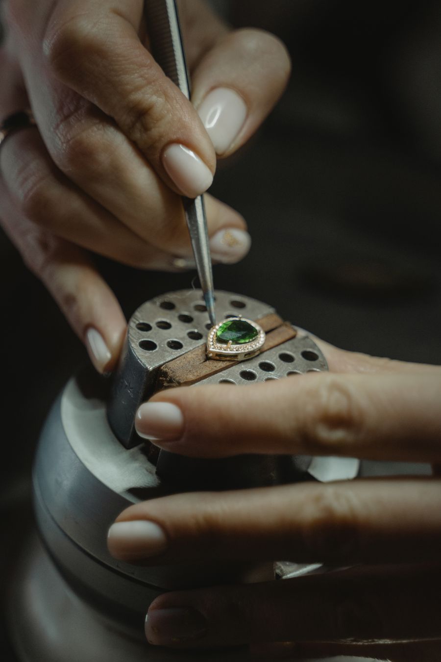 Master jeweler hand-setting a diamond ring