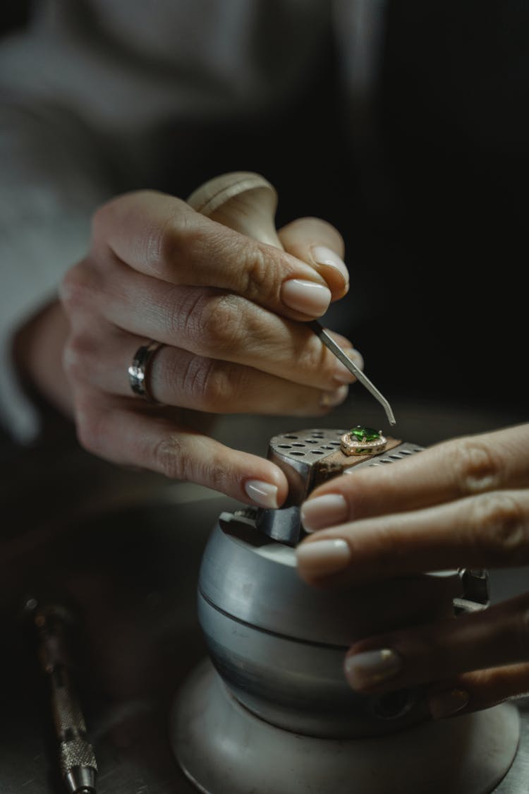 A Jeweler Handling An Emerald