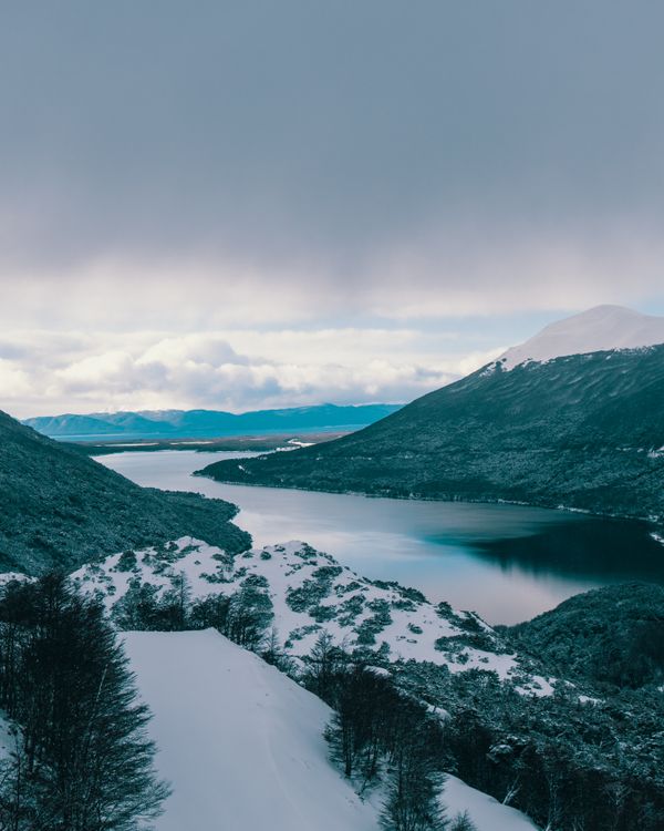 Lake Near Snow Capped Mountains · Free Stock Photo