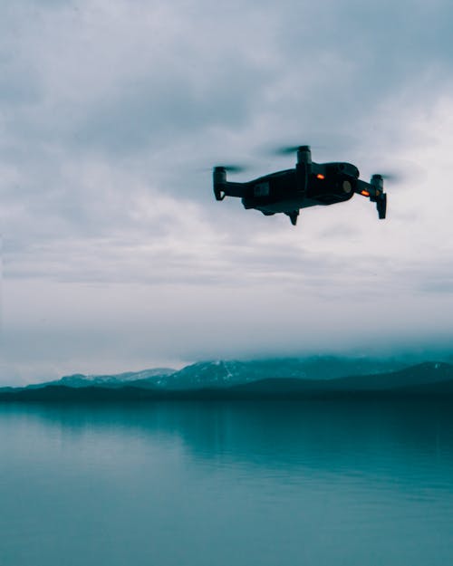 Low-Angle Shot of a Flying Drone above the Sea