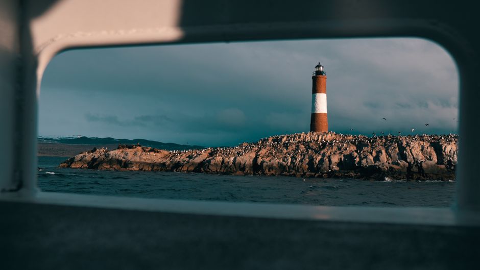 lighthouse rocky coastline wide view