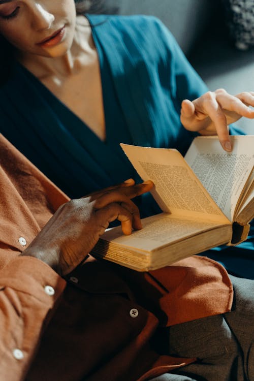 Free Couple Holding a Book Stock Photo