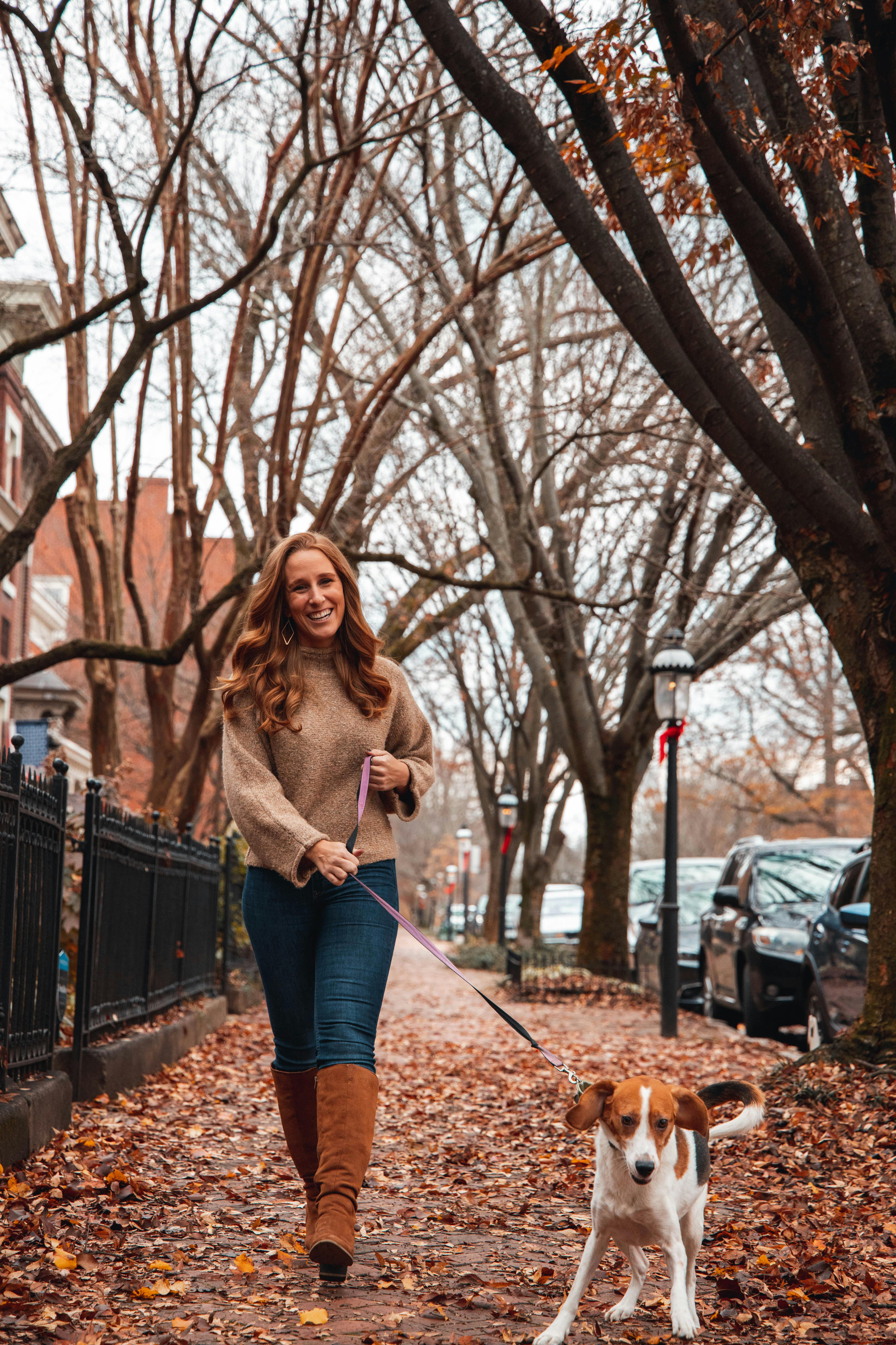 Woman Walking Her Dog on the Street