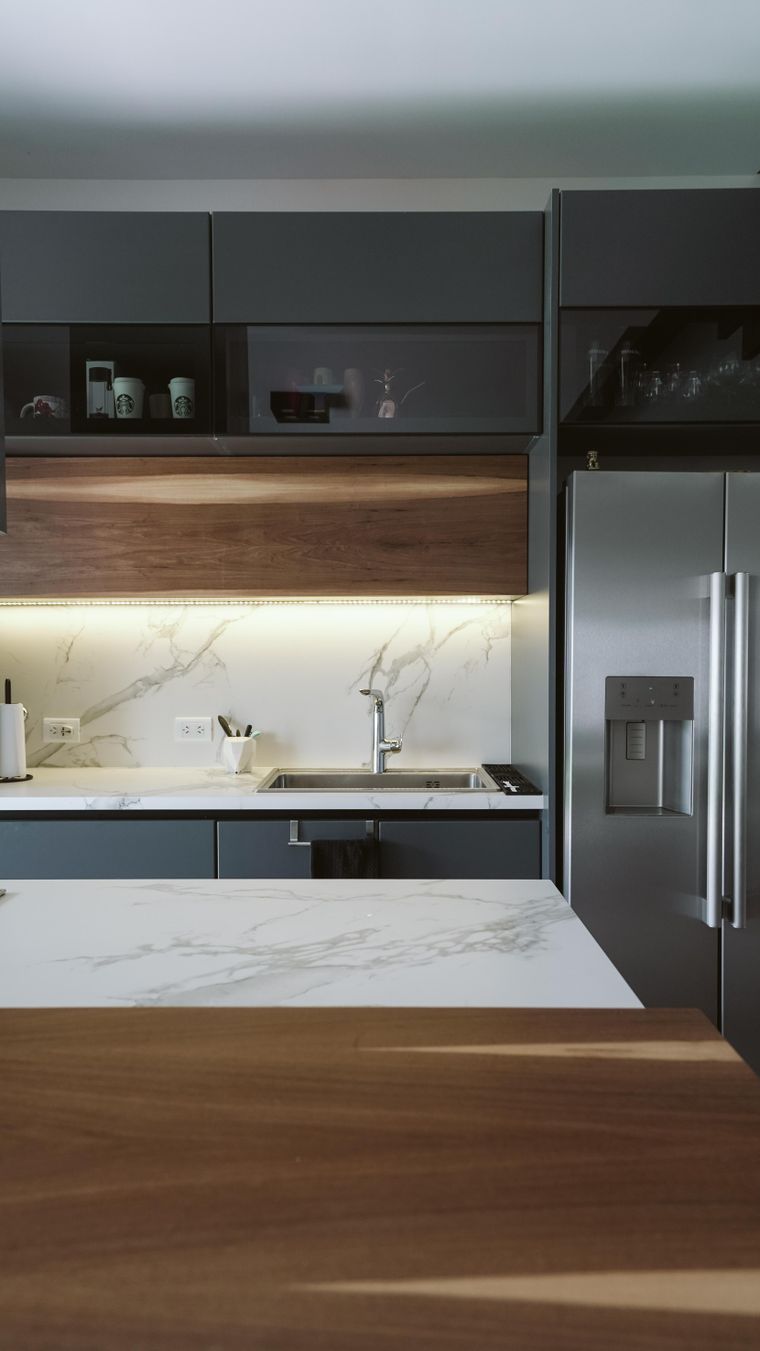 Sleek engineered stone kitchen worktop with integrated appliances