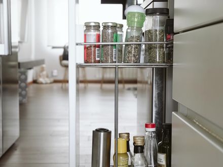 Pull-out shelf in a base cabinet