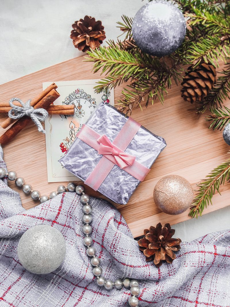 Christmas gift with festive decorations and natural accents