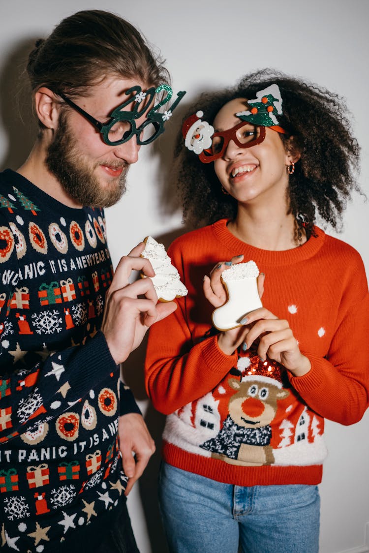 Couple Wearing Christmas Sweaters