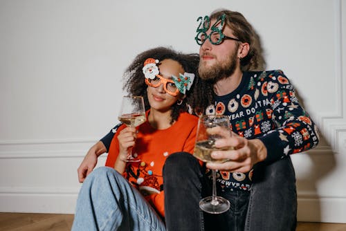 A Couple Holding a Glass of Wine