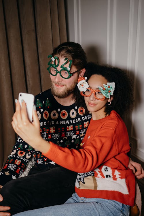 A Couple Smiling and Posing while Talkie Selfie 