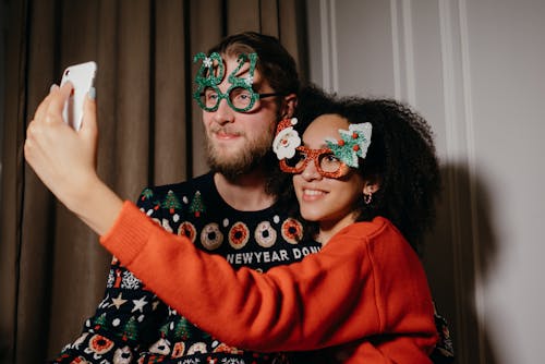 Free Couple Taking a Selfie Near the Curtain Stock Photo