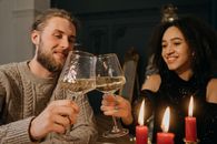 Woman in Gray Sweater Holding Clear Wine Glass