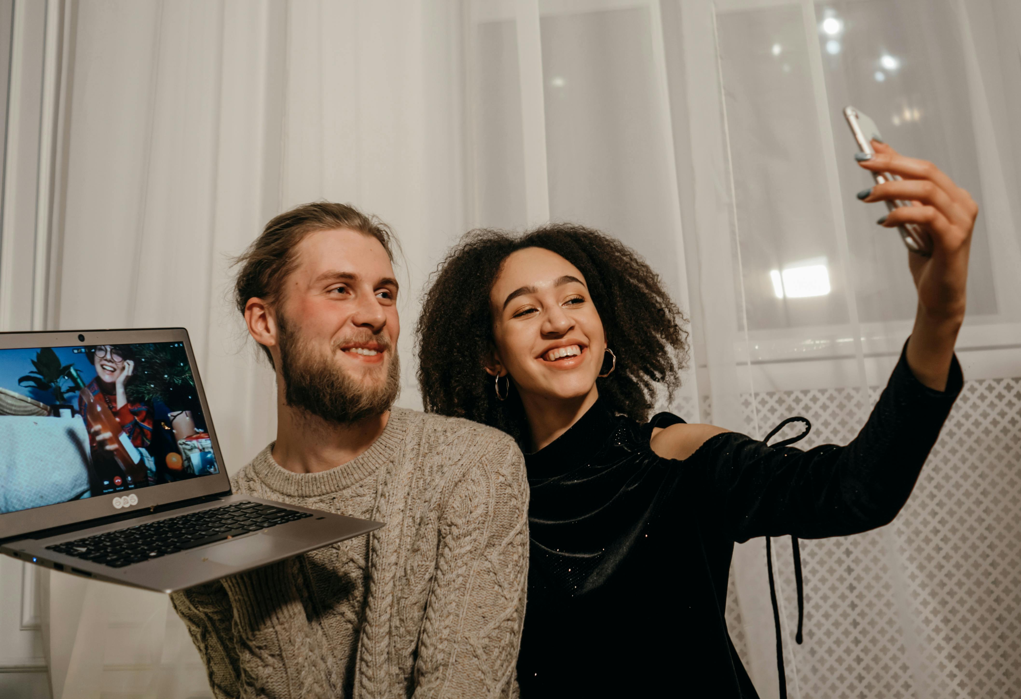 man and woman smiling at the camera