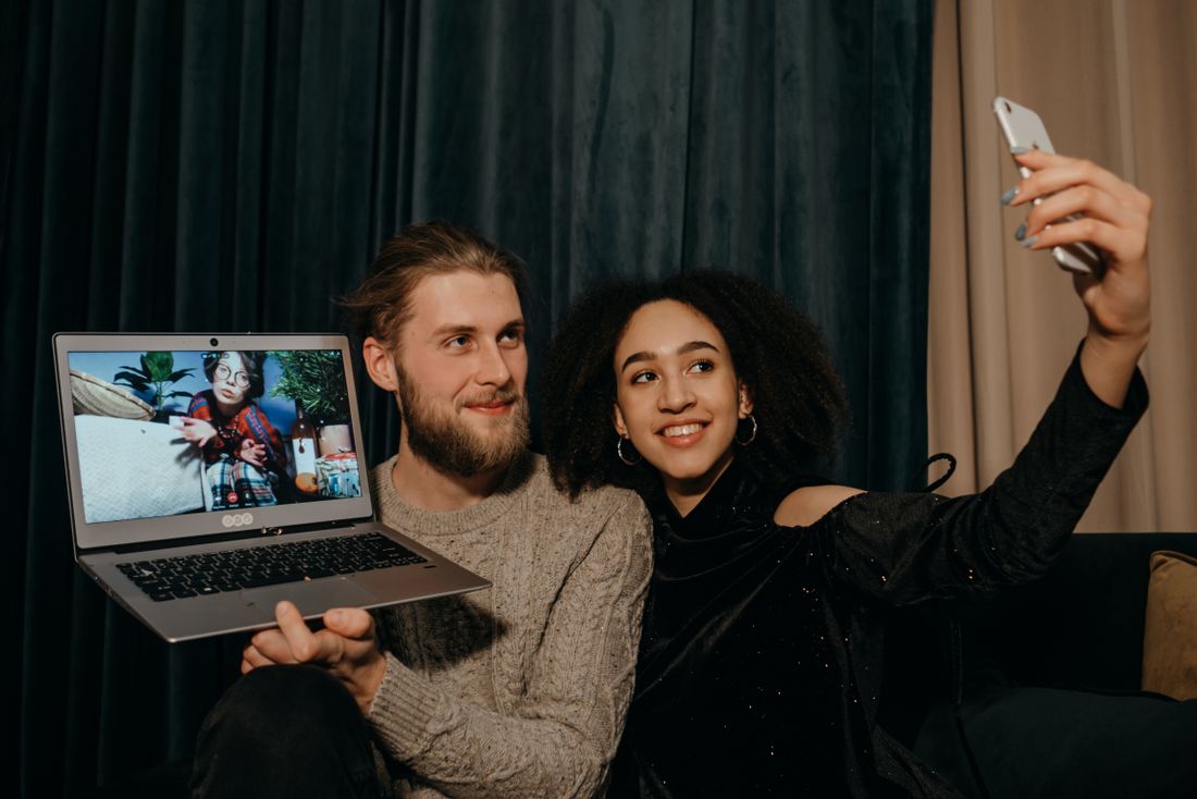 Two people sharing a joyful video call, illustrative photography