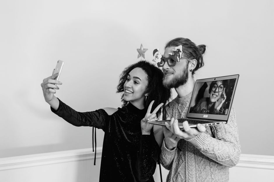 photobooth party guests taking selfies with props