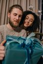 Man in Gray Crew Neck Shirt Beside Woman in Blue Shirt