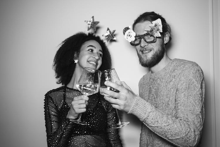 Man And Woman Holding Glasses Of Wine