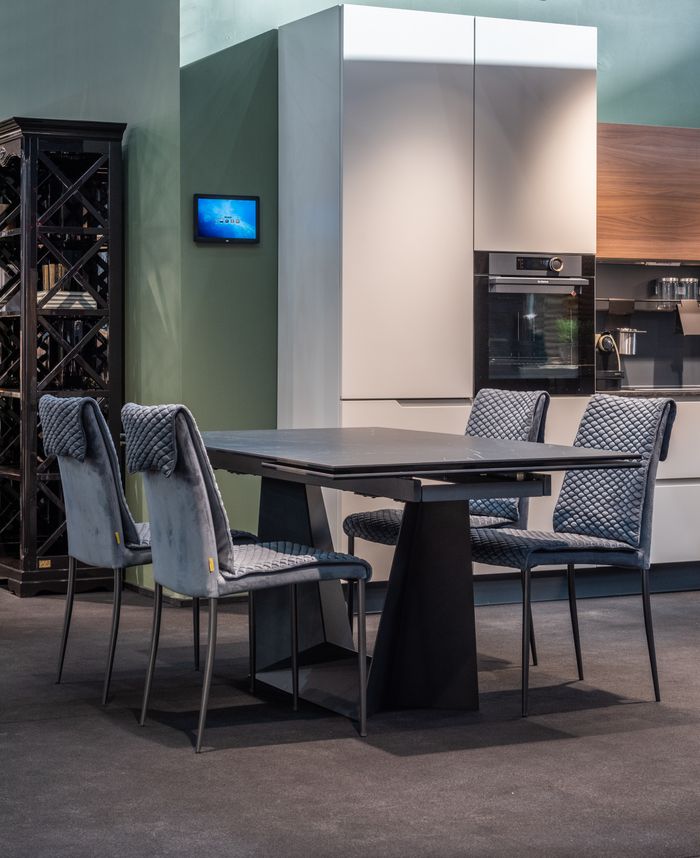 Walnut dining table in a stone-and-timber kitchen — photo by Max Vakhtbovych on Pexels