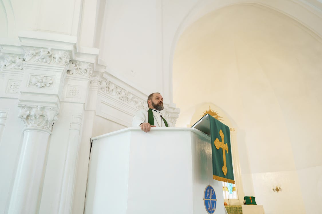 Free Priest Praying at the Pulpit  Stock Photo