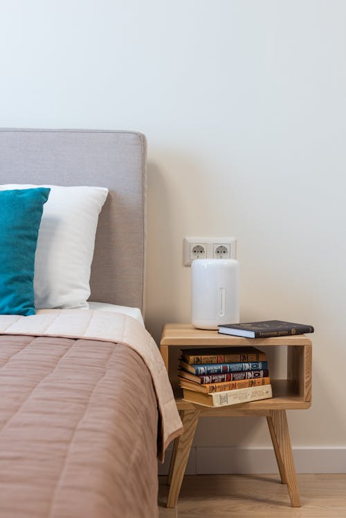 White Electric Heater on Brown Wooden Table