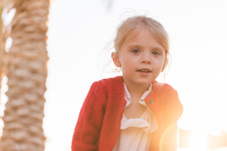 Cute Child Near Palm Tree During Vacation