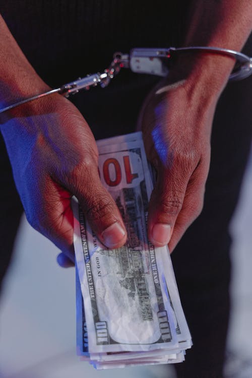 Person Holding 100 Us Dollar Bill