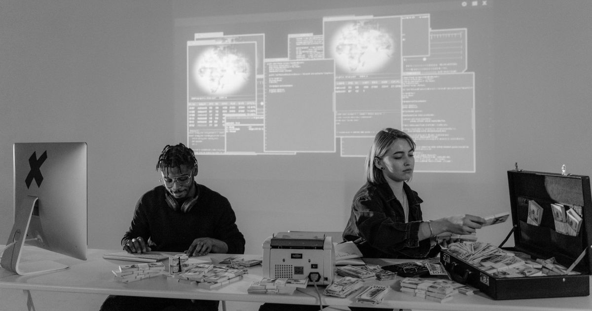 A futuristic workspace with professionals working on advanced cybersecurity technology.