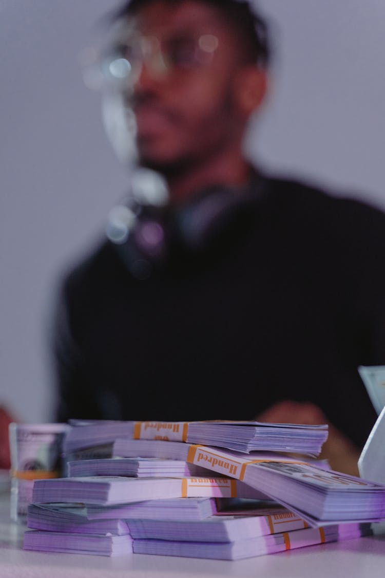 A Close-Up Shot Of A Stack Of Money