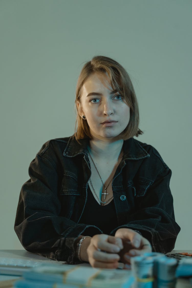 Portrait Photo Of A Woman Wearing A Black Denim Jacket