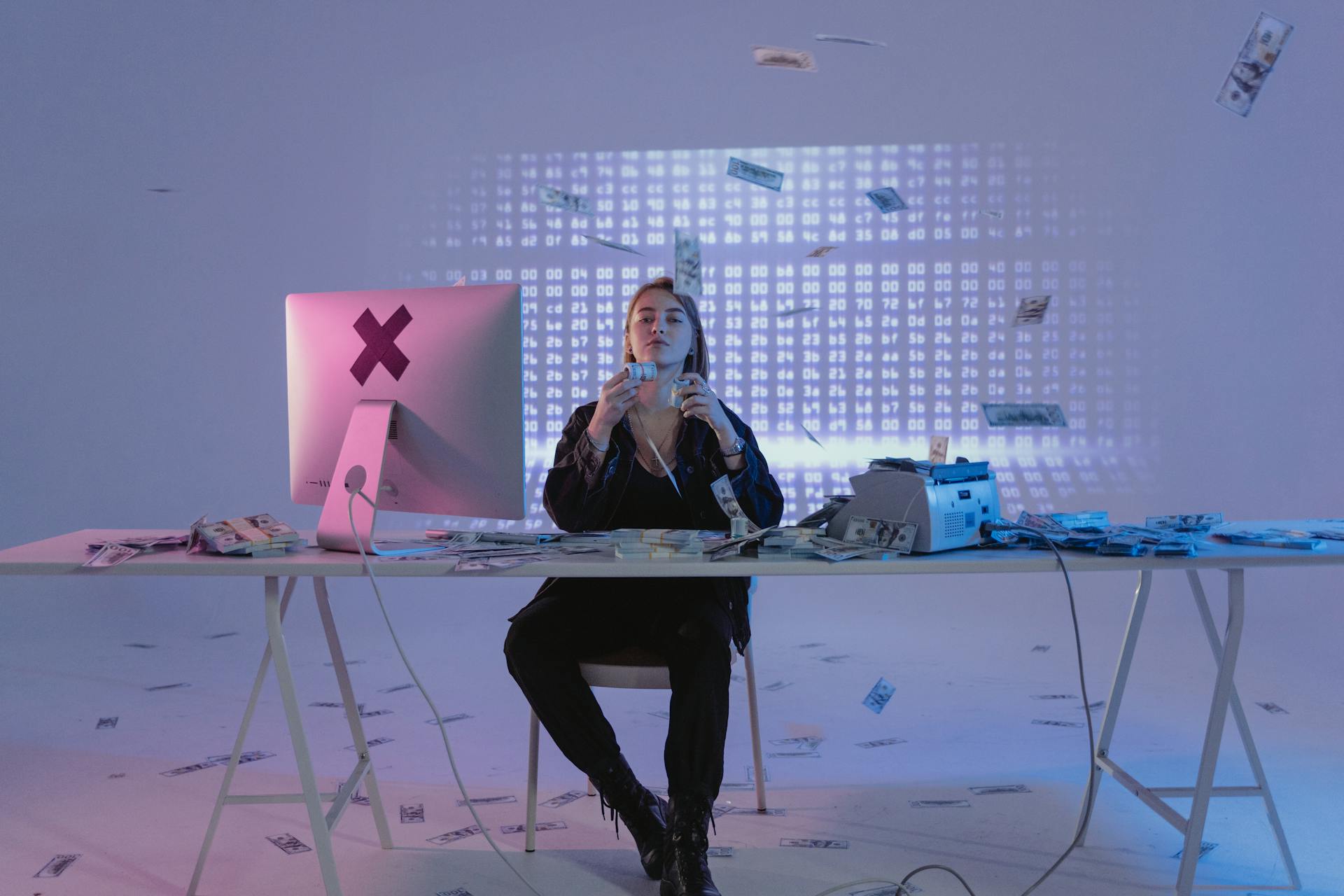 A woman in a tech-inspired setting with digital graphics, surrounded by money, suggesting modern finance themes.