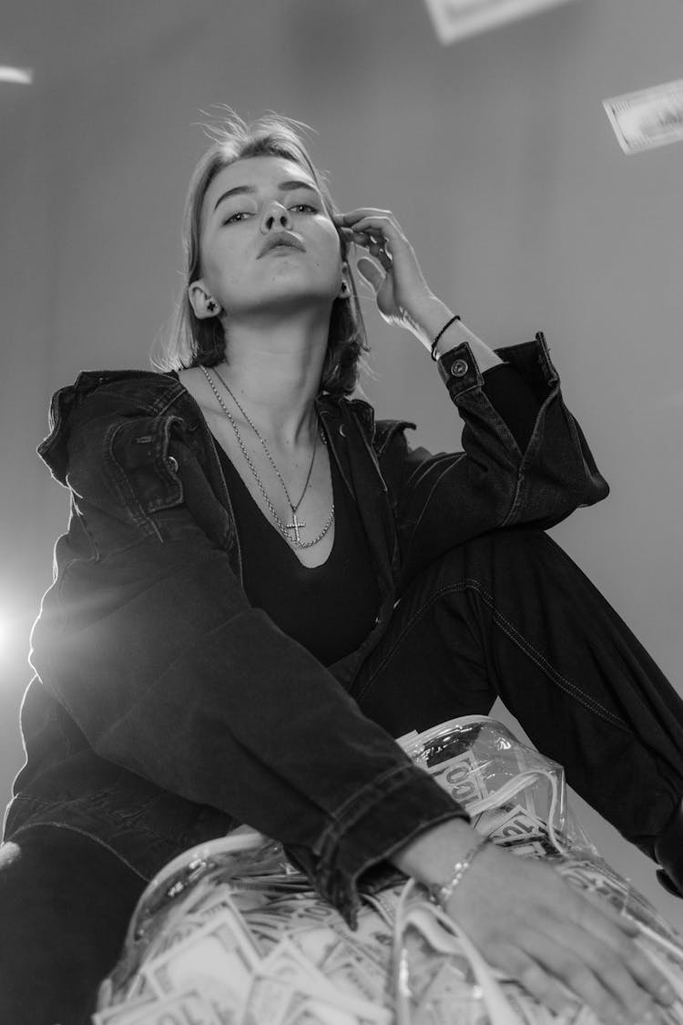 Black And And White Photo Of Woman In Denim Jacket And Pants 