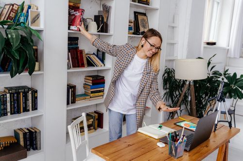Person on a video call in a home office — photo by AI25.Studio on Pexels