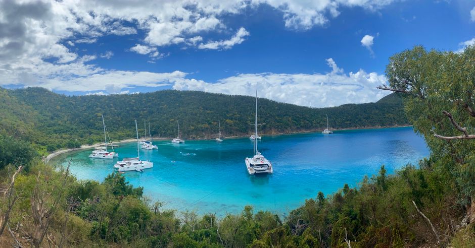 Outstanding Full-Day Charter Virgin Gorda British Virgin Islands Review: My Complete Guide to This Luxury Yacht Experience Review 2026 - A panoramic view of a bay with yachts docked, surrounded by lush greenery in the British Virgin Islands.