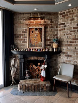 A cozy corner featuring a rustic brick fireplace and decorative elements in a vintage style.