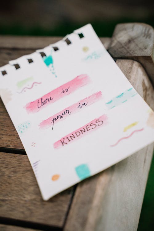 White Paper with Message on a Wooden Table