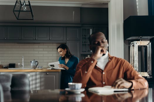 Elegant indoor scene of a couple enjoying a morning, reading and drinking coffee.