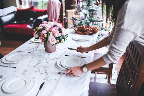 Free Woman Preparing Christmas Table Stock Photo