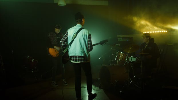 A band performing live music in a dim, atmospheric room with vibrant lighting.