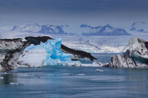 Free Captivating view of Iceland's Jokulsarlon glacier lagoon with icebergs and mountains. Stock Photo