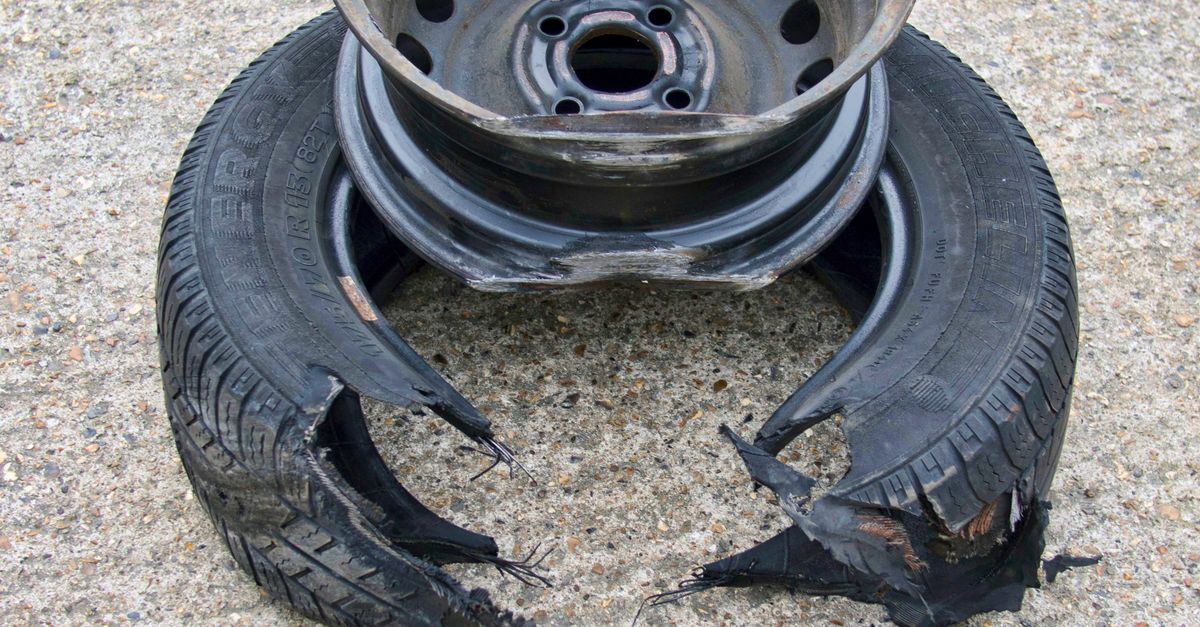 Destroyed Rims Close-up of a Damaged Rim and Tire · Free Stock Photo